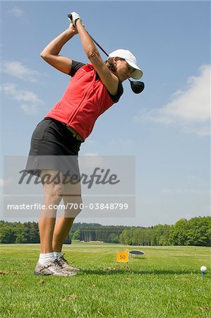 Woman at Driving Range