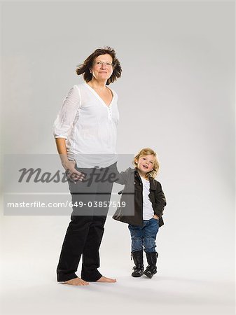 Older woman holding granddaughter's hand