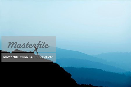 Man hiking on rocky hillside