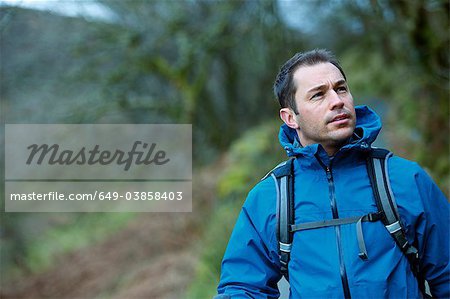 Man hiking in rural hillside