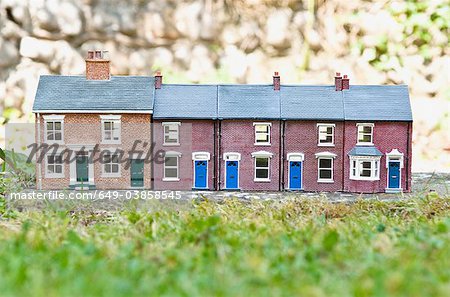 Model houses on stone outdoors