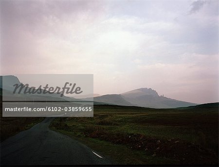 View of country road with mountains in background