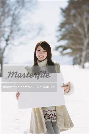 Teenage Girl Holding Whiteboard