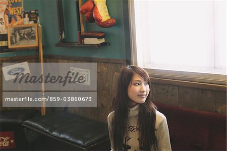 Teenage Girl Looking Away Inside A Room