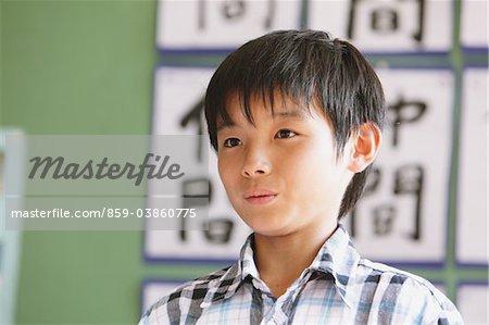 Japanese Schoolboy Answering In Classroom
