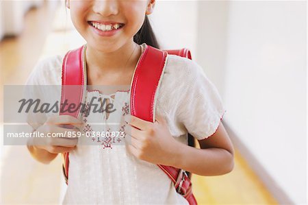 Happy Smiling Girl With School Bag
