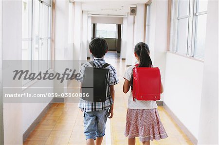 School Friends Walking Together In Corridor