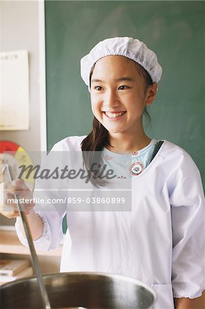 Girl Preparing Food In Classroom