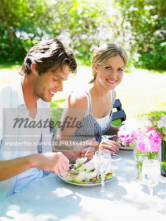 A couple having dinner outdoors, Stockholm, Sweden.