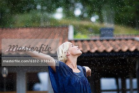 A woman enjoying the rain, Sweden.