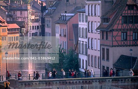 Pedestrians on the Ponts-couverts (Covered-bridges) over the River Ill, overlooking the Petite France quarter, Grande Ile, UNESCO World Heritage Site, Strasbourg, Alsace, France, Europe