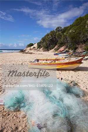 Fishing boats and nets on beach, Tofo, Inhambane, Mozambique, Africa
