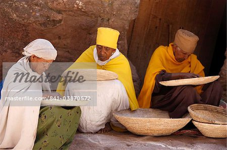 Nuns sorting wheat in Bet Maryam church courtyard, Lalibela, Wollo, Ethiopia, Africa