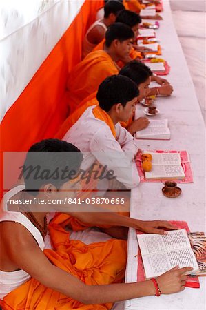 Brahmachari (Hindu temple students) studying scriptures, Haridwar, India, Asia
