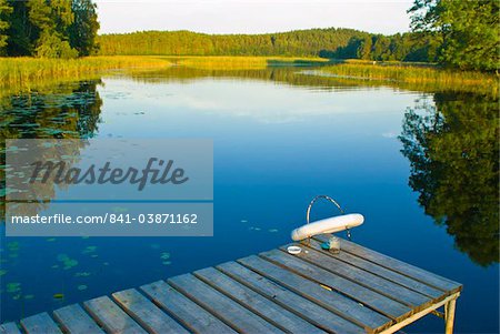 Little pier at peaceful lake in the Aukstaitija National Park, Lithuania, Baltic States, Europe