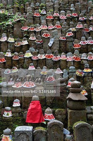 Stone jizo statues with red aprons in the Okunoin Temple cemetery at Koyasan (Mount Koya), Wakayama, Japan, Asia