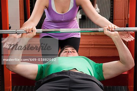 Man lifting weights in gym