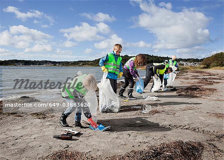 Group of workers cleaning beach