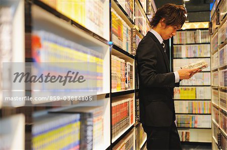 Businessman in Japanese Manga Cafe