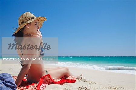 Woman relaxing on Floreat Strand, Perth, Western Australia, Australien