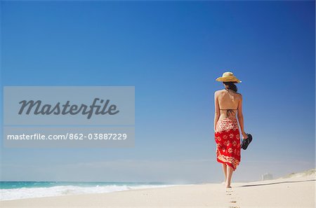 Woman walking on Floreat beach, Perth, Western Australia, Australia