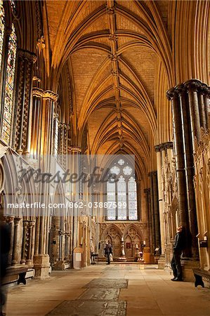 Lincoln, England. A visitor gazes at the medieval stone work in Lincoln cathedral. Lincoln, England. A visitor gazes at the medieval stone work in Lincoln cathedral.