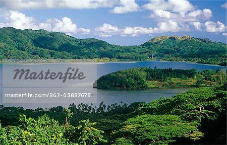 French Polynesia, Society Islands, Leeward Islands, Huahine Island, aka Matairea. Lush forests surround the deeply incised Maroe Bay which divides the island into Big Huahine, Huahine Nui, and Little Huahine,Huahine Iti.