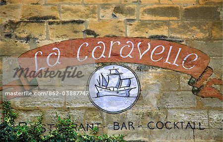 Arles; Bouches du Rhone, France; A restaurant sign painted on a wall