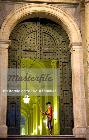 Rome, Italy; A Swiss guard at the entrance gates to the Vatican