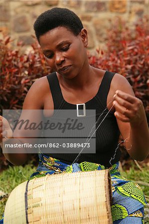 Kigali, Rwanda. A traditional basket maker weaves an Agaseki style peace basket.