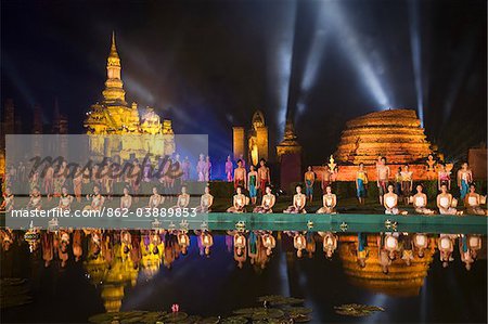 Thailand, Sukhothai, Sukhothai.  Sound and Light Show at Wat Mahathat in the Sukhothai Historical Park.  The show is part of the Loy Krathong festival held in November, featuring cultural performances, parades and the floating of lotus shaped boats (krathong).
