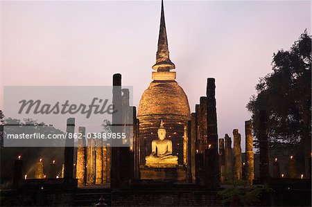 Thailand, Sukhothai, Sukhothai.  Ruins of Wat Sa Si (also known as Sacred Pond Monastery) lit during the festival of Loy Krathong in the Sukhothai Historical Park.