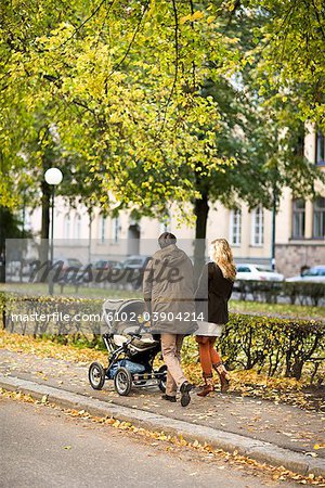 A couple taking a walk with their son, Sweden.