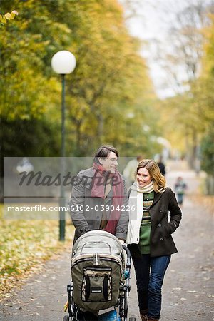 A couple taking a walk with their son, Sweden.