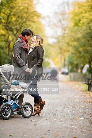 A couple taking a walk with their son, Sweden.