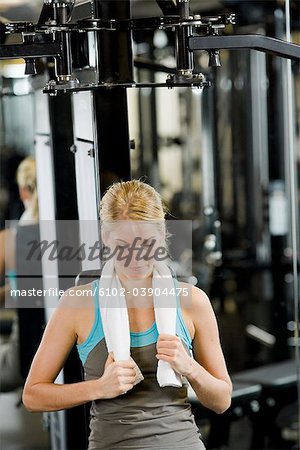 Woman weight training at a gym, Sweden.
