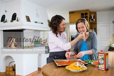 Mother and daughter cooking, Sweden.