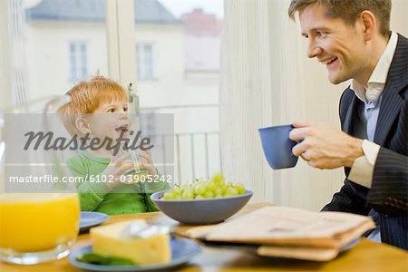 Father and son having breakfast, Sweden.