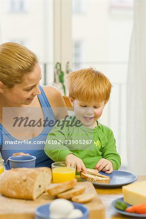 Mother and son having breakfast, Sweden.