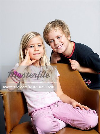 Siblings smiling, portrait