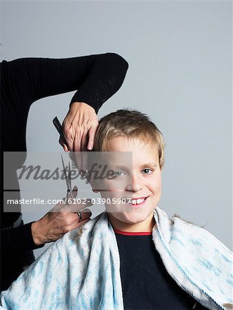 Boy getting haircut