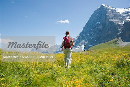 Backview of Woman Hiking, Berense Oberland, Eiger Peak, North Face, Switzerland
