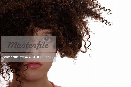 Innocent teenager with naturally curly hair with white background
