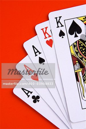 A full house poker game on red background.