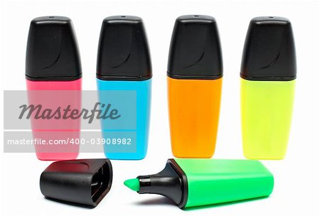 Assortment of coloured labellers with shadow on white background
