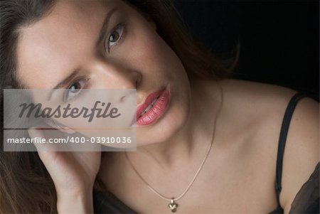 Beautiful brenette portrait over dark background