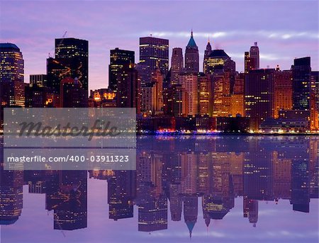 Early Morning Manhattan skyline with water reflection