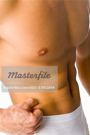 Closeup of athletic male body - there is no fat. Isolated on white in studio.