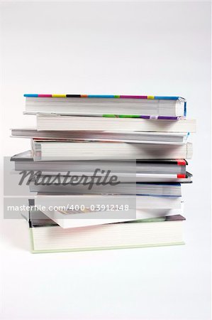 A stack of books against a plain background