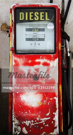 Antique diesel gas pump in red color.